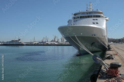 Luxury cruise ship cruise ship liner yacht Silver Shadow Whisper in port of downtown Cadiz, Spain at pier terminal in city center for tour excursions exclusive location photo