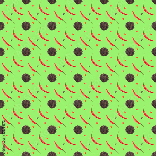 Seamless spice pattern with red chili pepper pods, slices of cut pepper, heaps of black pepper on green background. Aspect ratio 1:1