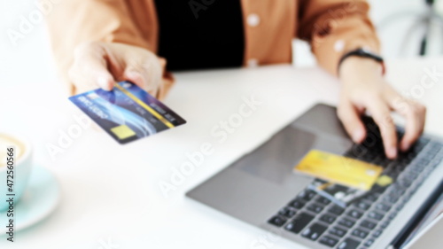   Woman hand has a credit card,Online shopping,blurry pictures