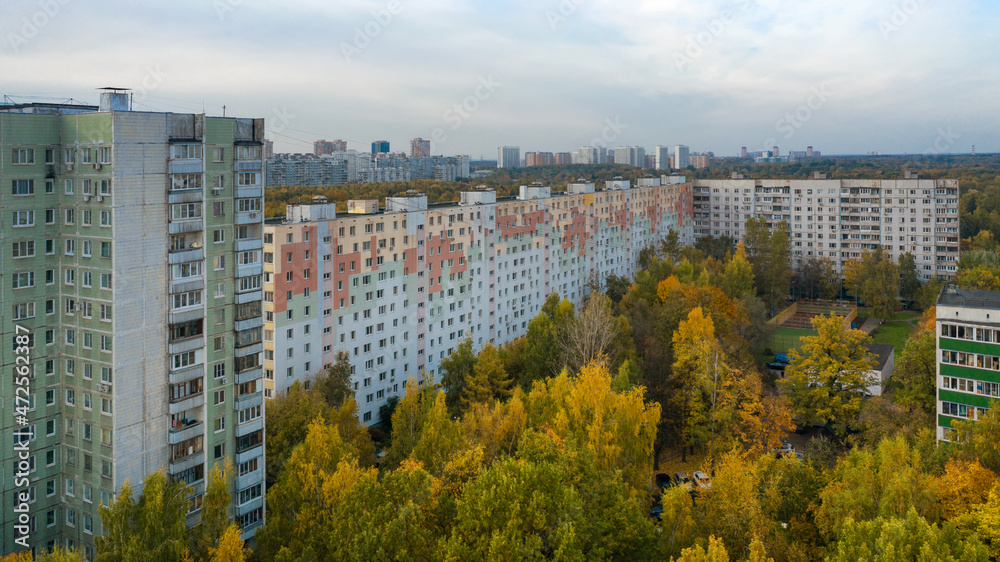 Aerial view of residential buildings in the Moscow district of Lianozovo from the side of Linozovsky Park on a summer evening at sunset. 