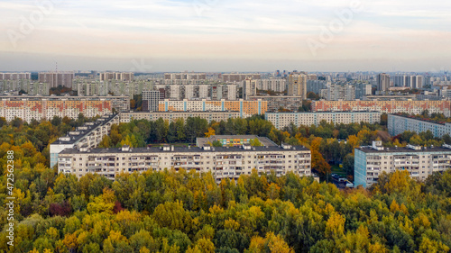 Aerial view of residential buildings in the Moscow district of Lianozovo from the side of Linozovsky Park on a summer evening at sunset. 