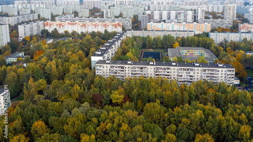 Photography Aerial view of residential buildings in the Moscow district of Lianozovo from the side of Linozovsky Park on a summer evening at sunset