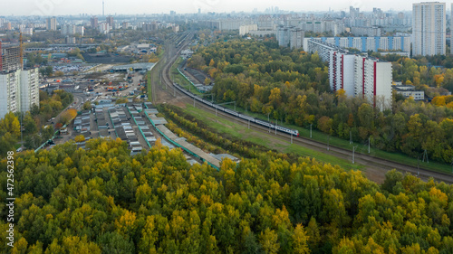 Aerial view of residential buildings in the Moscow district of Lianozovo and Beskudnikovo from the side of Linozovsky Park on a summer evening at sunset.  photo