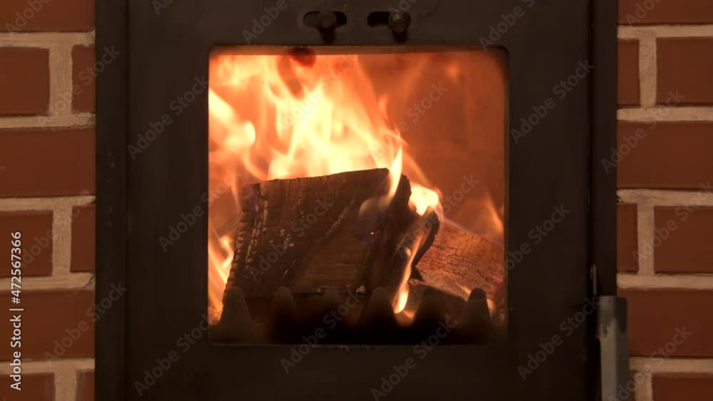 4K video of a fire burning in a brick chimney inside a house 4K video of a fire burning in a brick chimney inside a house