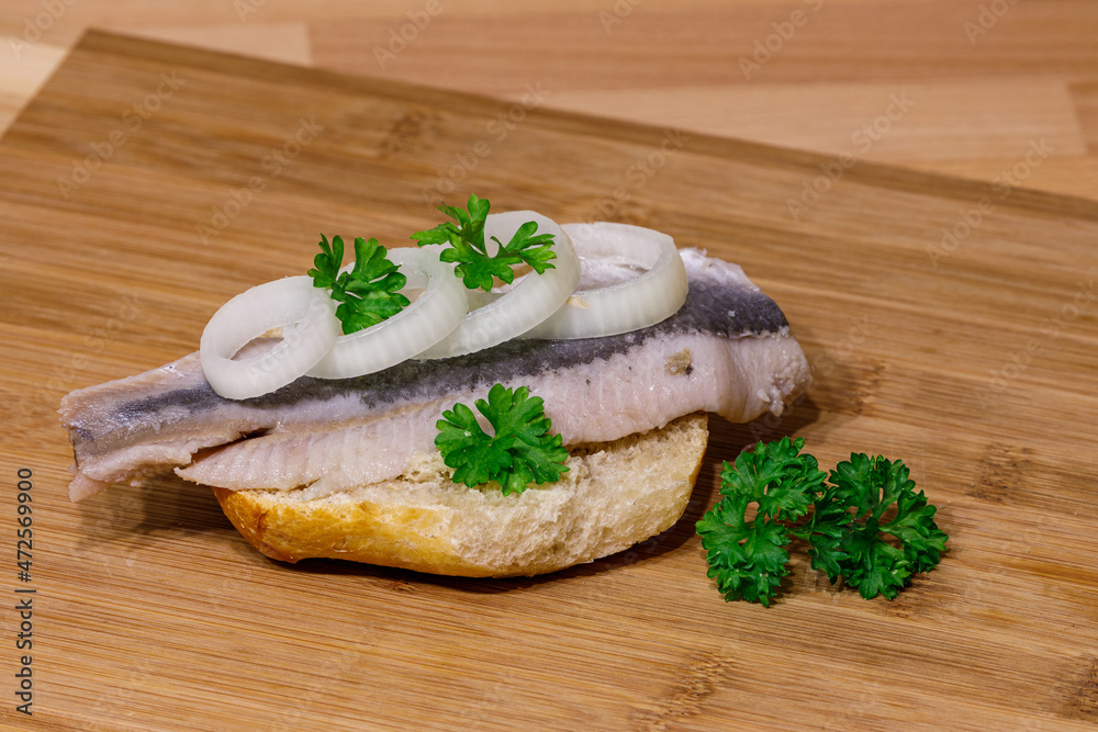 A sandwich with herring seafood A sandwich with herring seafood