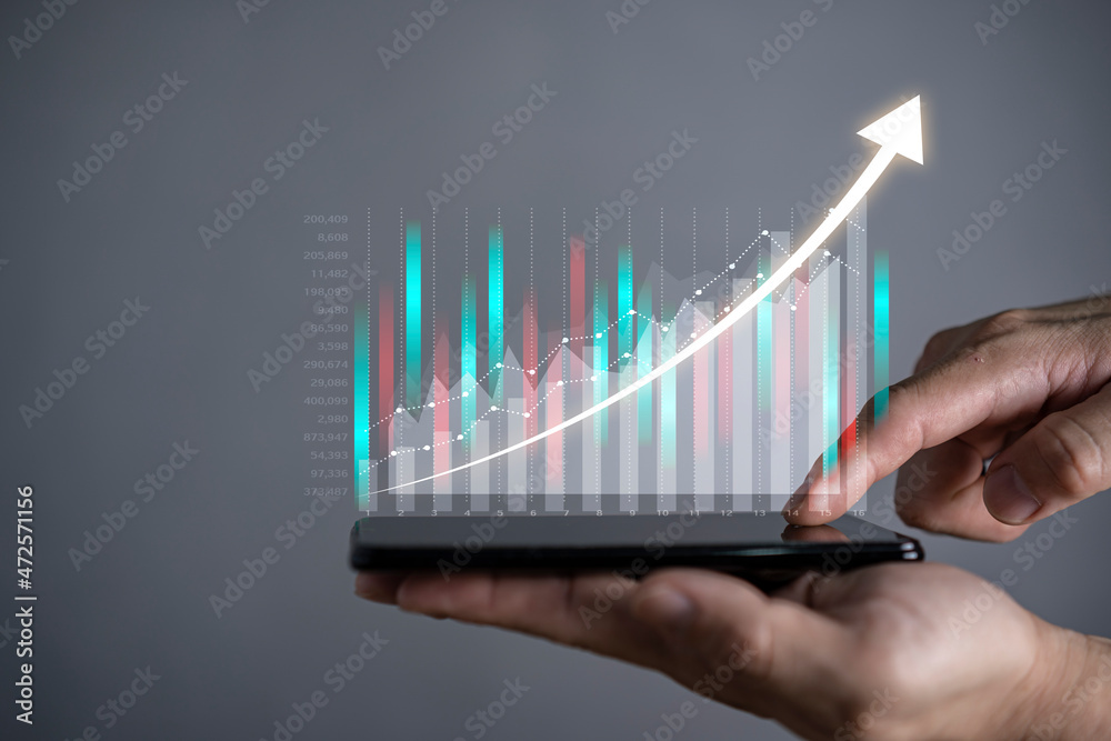 Hot business growth. Businessman using tablet analyzing sales data and economic growth graph chart. Hot business growth. Businessman using tablet analyzing sales data and economic growth graph chart.