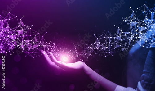 Hand holding global network connection. Internet communication, Wireless connection technology. Futuristic technology with polygonal shapes.Metaverse Technology
