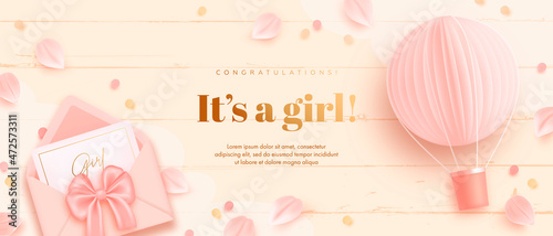 Baby shower horizontal banner with cartoon hot air balloon, envelope and petals on beige wooden background. It's a girl. Vector illustration