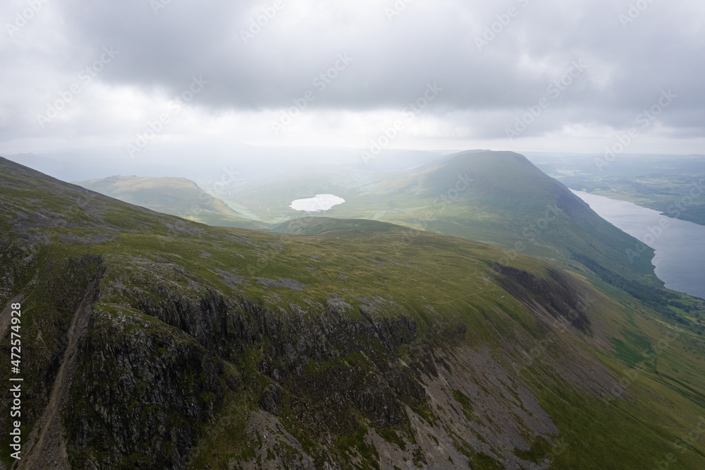 Aerial summer view in cloudy Scafell Pike, Lake District, United Kingdom Aerial summer view in cloudy Scafell Pike, Lake District, United Kingdom