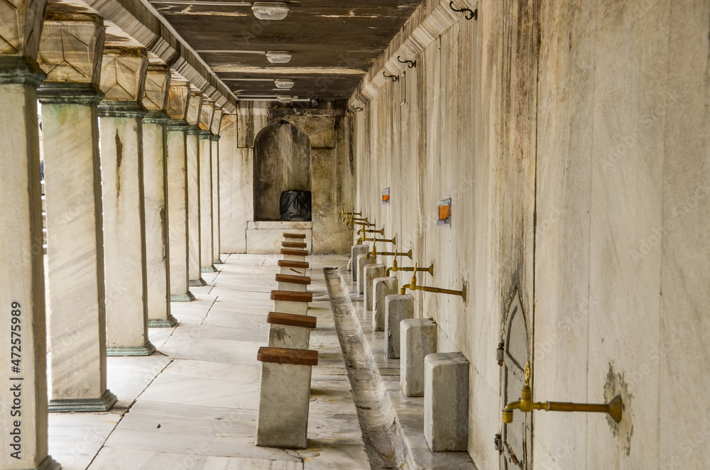 Old faucet in marble in the mosque. Istanbul Turkey