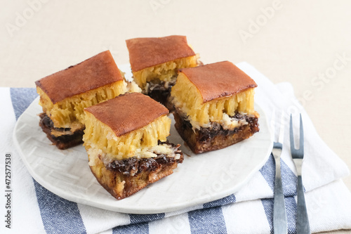 Martabak Manis or Kue Terang Bulan or Hok Lo Pan with various fillings is snack from Indonesia usually consumed at night. Served in white plate, selective focus image. 
