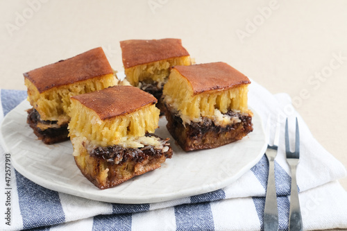 Martabak Manis or Kue Terang Bulan or Hok Lo Pan with various fillings is snack from Indonesia usually consumed at night. Served in white plate, selective focus image.
