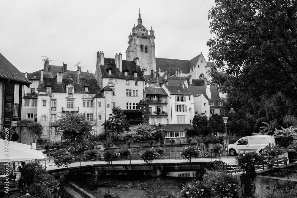 Amazing view of touristic city of Dole in France.Travel destination.Notre dame church in background.Black and white photography