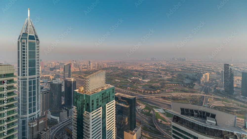 Fototapeta premium Panorama of Dubai Marina with JLT skyscrapers and golf course timelapse, Dubai, United Arab Emirates.