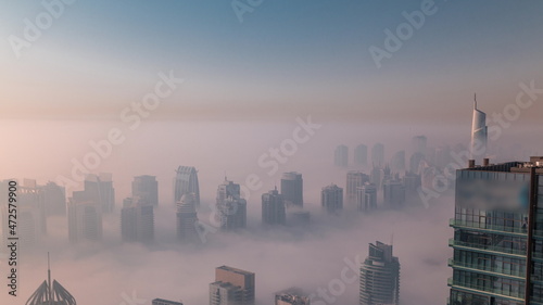 Photography Fog covered JLT skyscrapers and marina towers near Sheikh Zayed Road aerial timelapse after sunrise