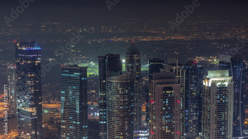 JLT skyscrapers near Sheikh Zayed Road aerial night timelapse. Residential buildings