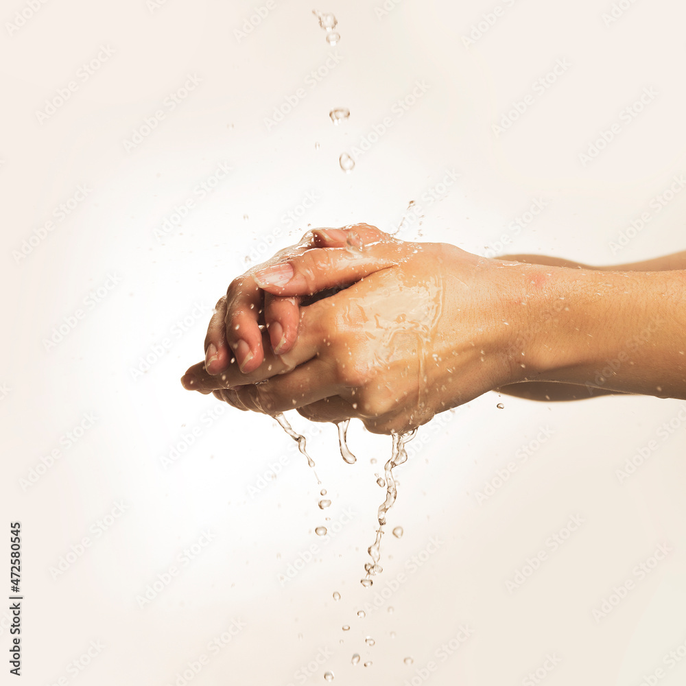 washing hands in water on white bacground