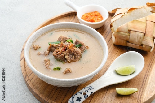 Coto Makassar, traditional food from Makassar, South Sulawesi. made from beef offal mixed with beef, seasoned with specially formulated spices. Usually served with Burasa or Ketupat ( rice cake ).
 photo