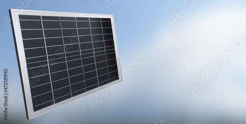 Mini solarcell panel with natural blurred landscape background, concept for storing and using the power from the nature in daily life.