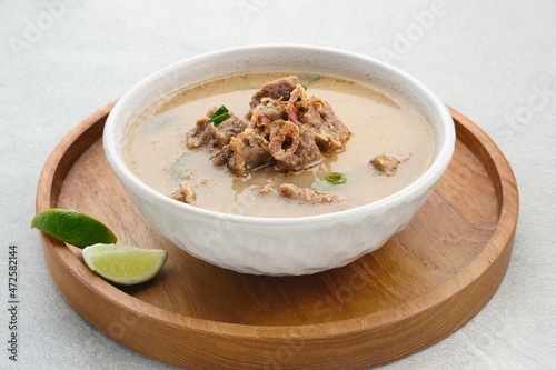 Coto Makassar, traditional food from Makassar, South Sulawesi. made from beef offal mixed with beef, seasoned with specially formulated spices. Usually served with Burasa or Ketupat ( rice cake ).
