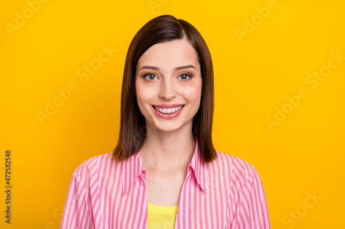 Photo of charming cheerful lady have good mood look camera isolated on bright yellow color background
