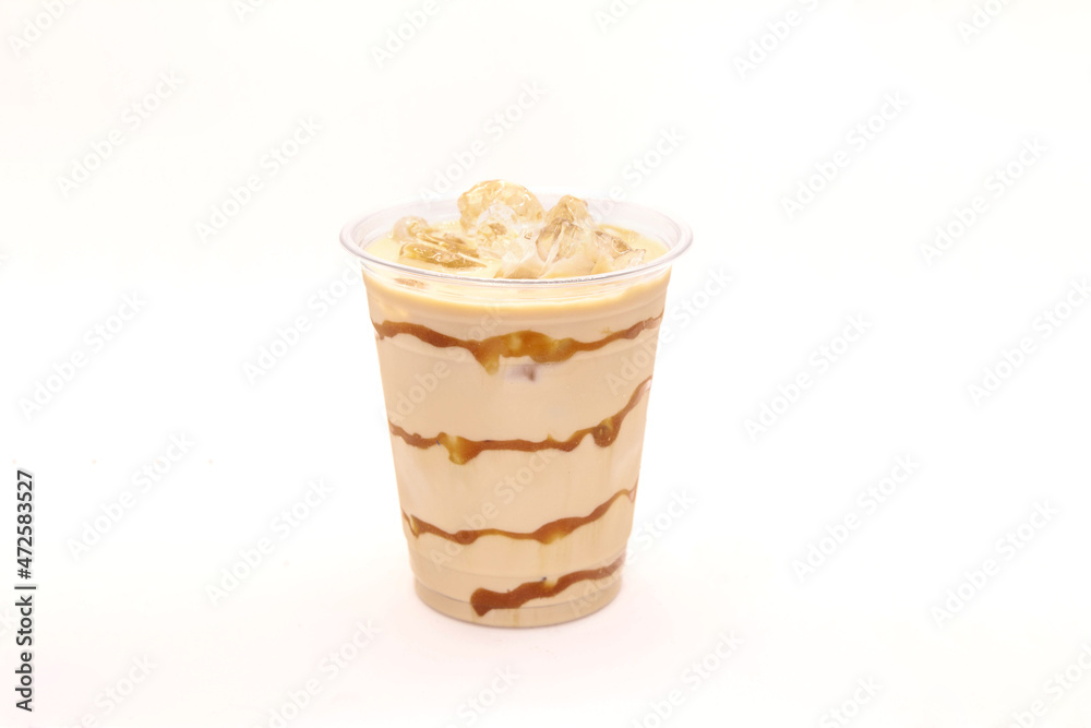 Caramel iced latte served in a disposable coffee cup. Caramel iced latte served in a disposable coffee cup.