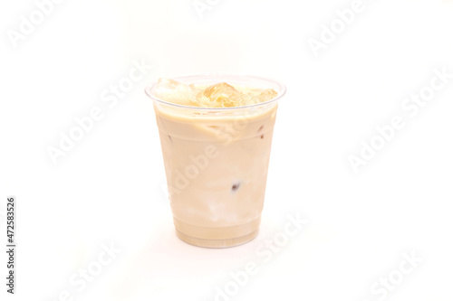 Caramel vanilla iced latte served in a plastic to go cup.