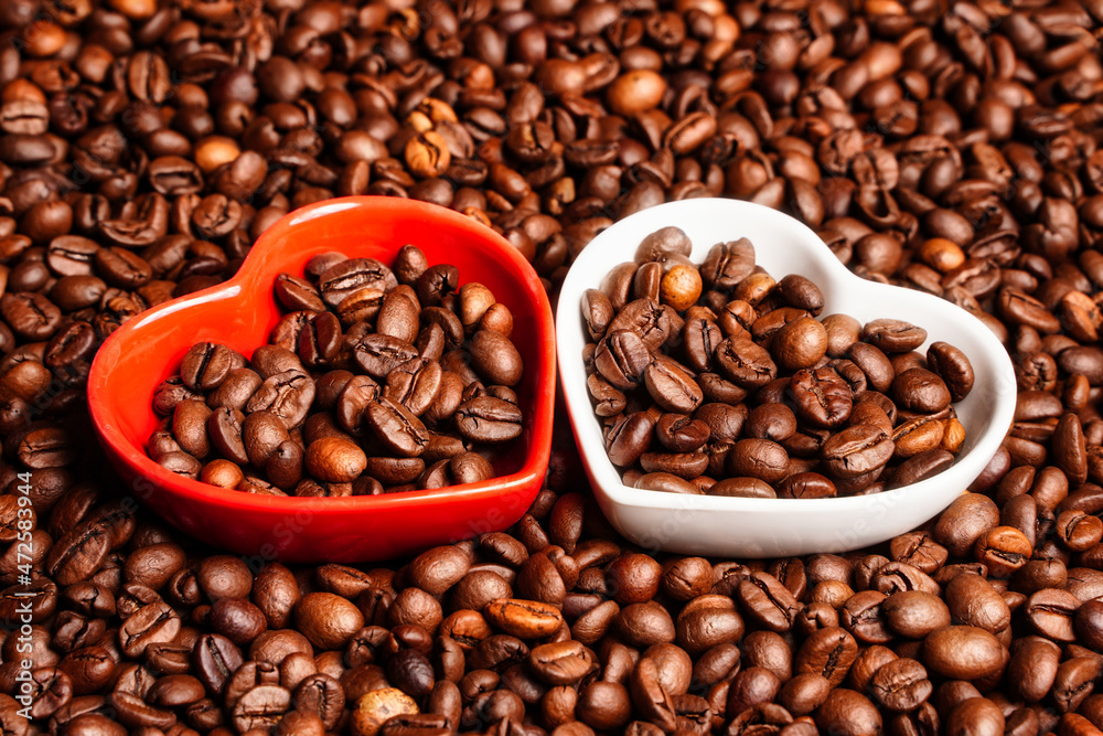 Fototapeta premium Selective focus on hearts with coffee beans. Good morning coffee lover. Close up