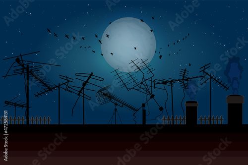 Night sky with full moon, flock birds and roof with many tv antennas. Silhouettes of different television receiver aerials on housetop. Old television reception aerials on rooftop. Vector illustration photo