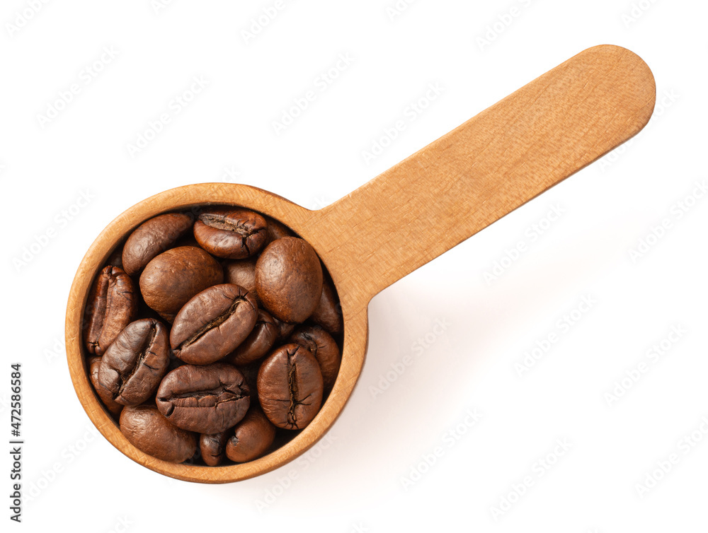 Fototapeta premium Coffee beans in the wooden spoon, isolated on white background, top view