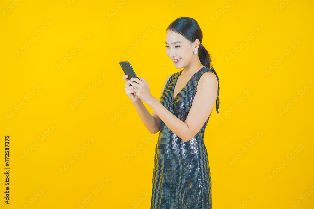 Portrait beautiful young asian woman smile with smart mobile phone