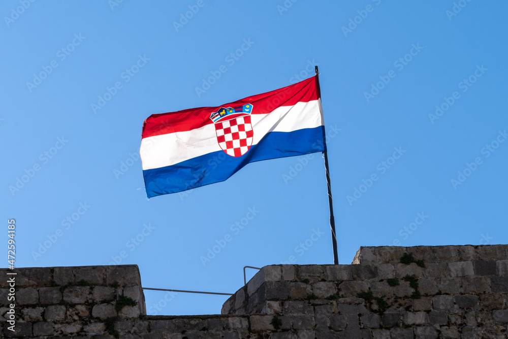 close up view of the Croatian flag in a strong wind under a blue sky