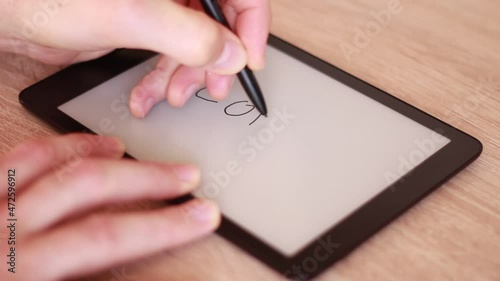 Writing COVID on Electronic tablet