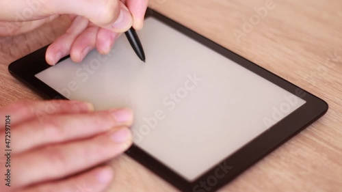 Writing VIRUS on Electronic tablet