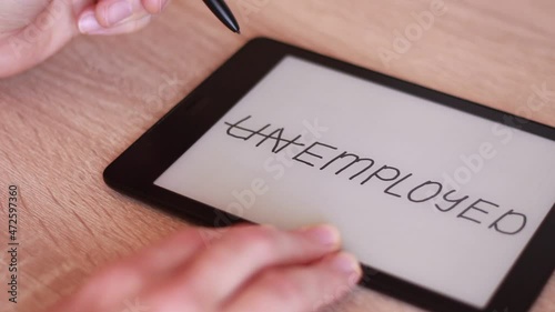 Inscription UNEMPLOYED on Electronic tablet