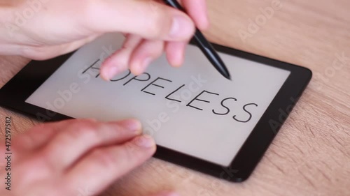 Inscription HOPELESS on Electronic tablet