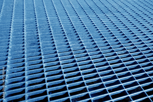 Metal grid pattern with blur effect in navy blue tone.
