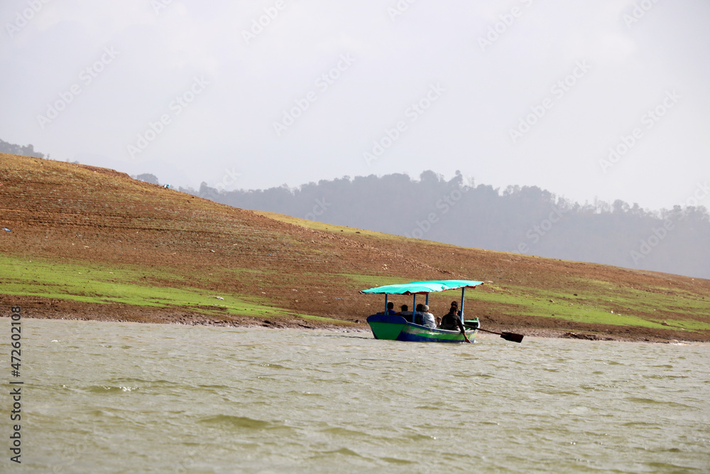 Fototapeta premium landscape view of ferry boat with tourist for ride in lake of dudhni (India)