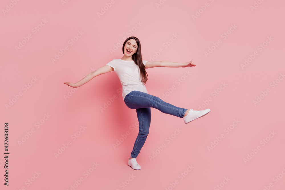 Full size photo of young cheerful girl happy positive smile have fun excited isolated over pink color background Full size photo of young cheerful girl happy positive smile have fun excited isolated over pink color background
