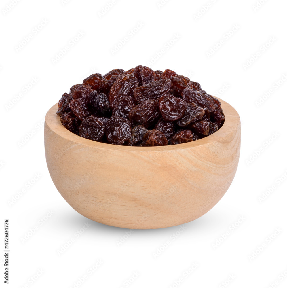 Dried raisins in the wooden bowl isolated on white background Dried raisins in the wooden bowl isolated on white background