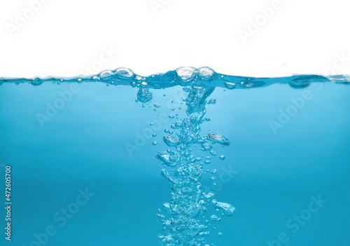Water waves splash with air bubbles, isolated on the white background. abstract blue water waves on a white background. for a product, advertising,text space