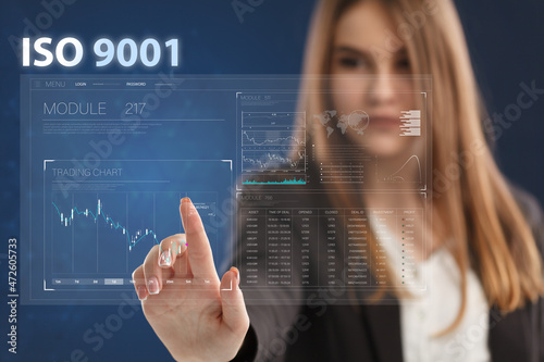Business, Technology, Internet and network concept. Young businessman working on a virtual screen of the future and sees the inscription: ISO 9001