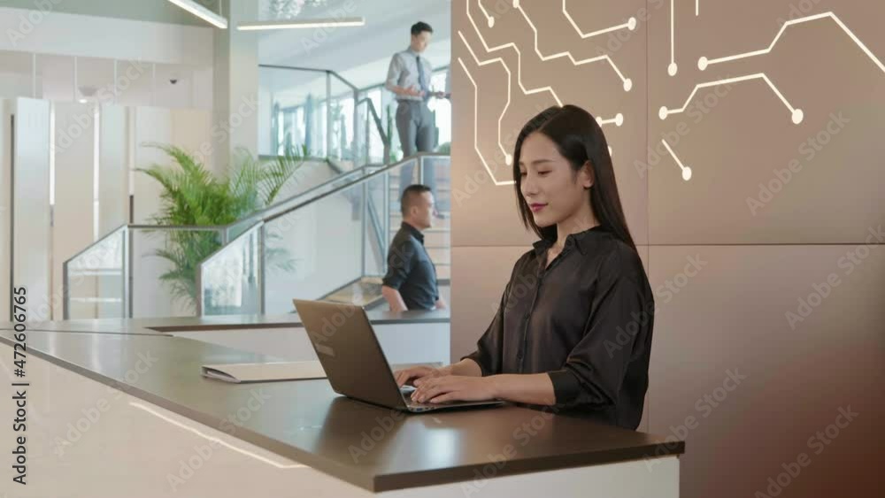 Young businesswoman standing at office reception desk,4K