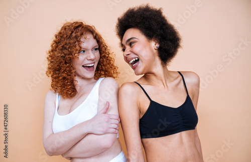 beauty image with two young women with different skin and body © oneinchpunch