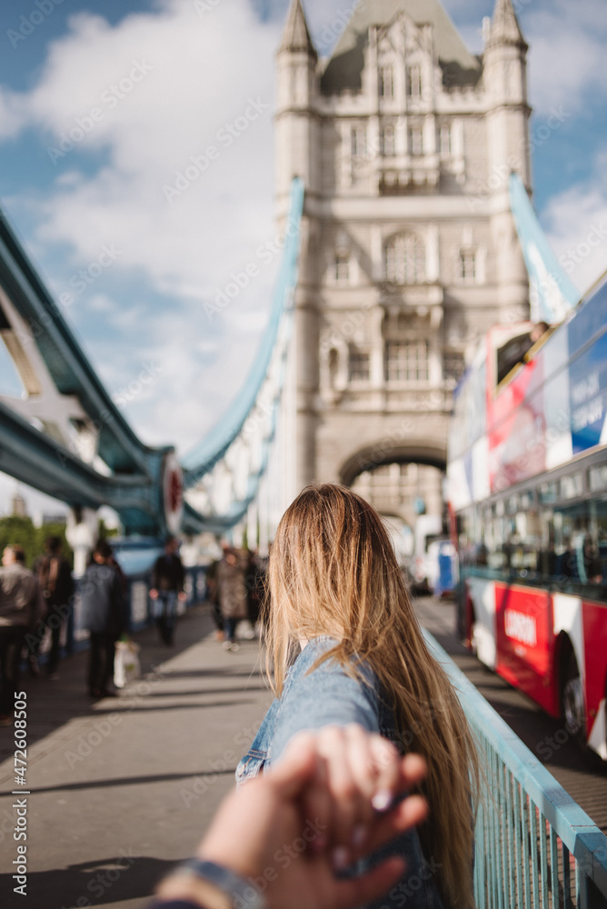 woman walking on the Tower Bridge