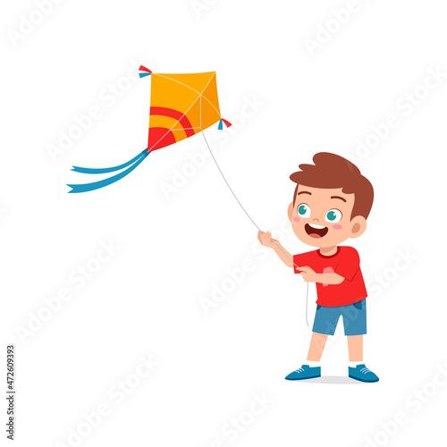 cute little boy play kite outside and feel happy