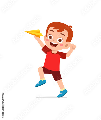 cute little boy play paper plane and feel happy