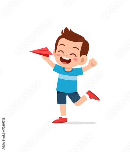cute little boy play paper plane and feel happy