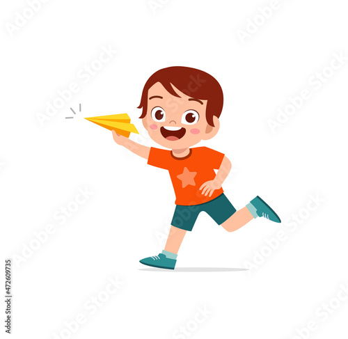 cute little boy play paper plane and feel happy