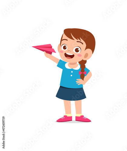 cute little girl play paper plane and feel happy